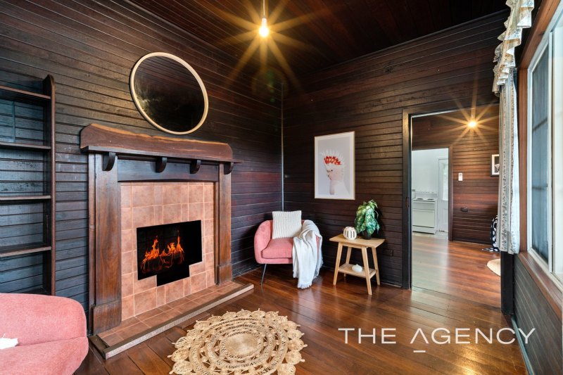 The home features an original open fireplace built circa 1918.