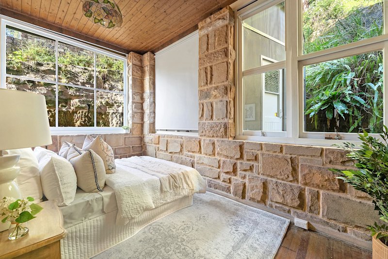 The home in Chatswood West was hand-built from sandstone quarried onsite.