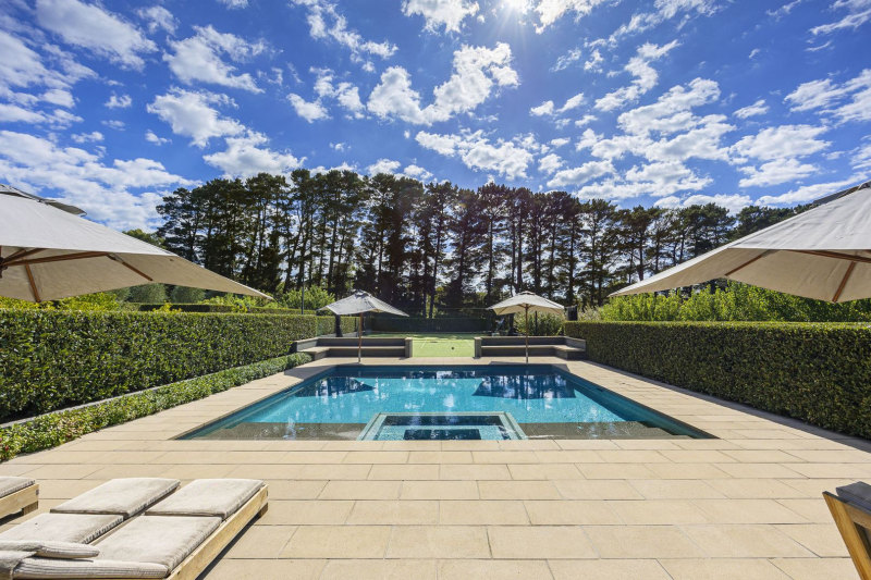 Box hedging frames the pool.