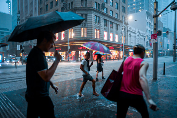 Heavy rain falls on the Sydney CBD on Monday afternoon.