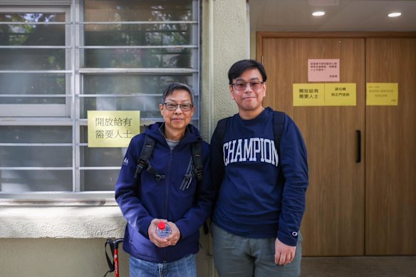 Toby Wong (right) searches for news of his mother with his uncle Edwin Wong.






