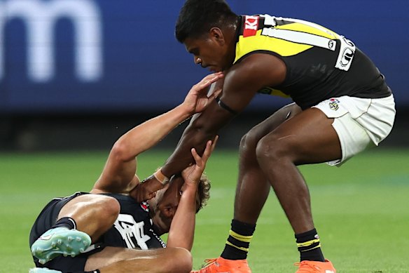 Maurice Rioli jnr catches Oliver Florent.
