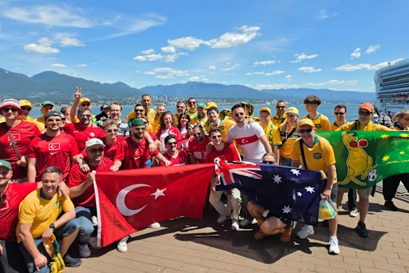 Australian fans travelling with Kevin Pollard, with Turkish fans before the two nations met in Vancouver in June.