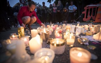 People gather outside the Al Noor mosque in Christchurch to pay their respects after the massacre in 2019. 