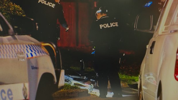 The scene on Royal Parade, Ashgrove, where a man died after he rode a bicycle into a parked car.