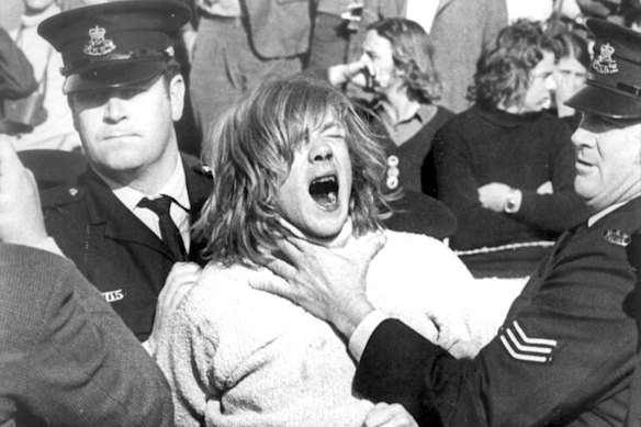 An anti-Apartheid protester is restrained during the Springboks’ 1971 tour of Australia.