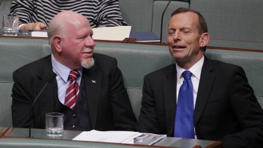 Dr Mal Washer (left) lobbied his party, led by then opposition leader Tony Abbott, to support plain packaging rules.