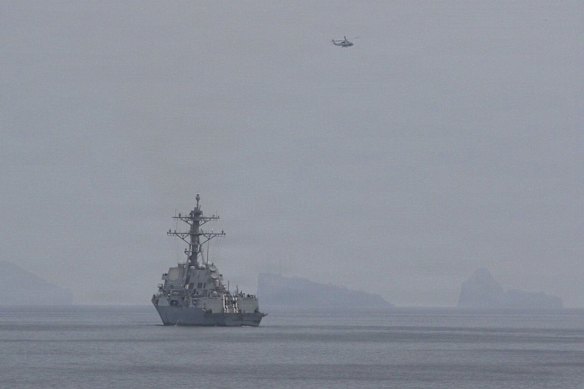 A Navy destroyer in the US Central Command area of operations transits the Strait of Hormuz last week.