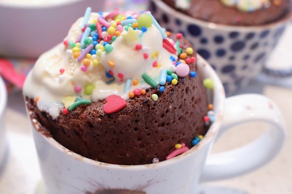 Serve molten chocolate mug cake with ice-cream and sprinkles.