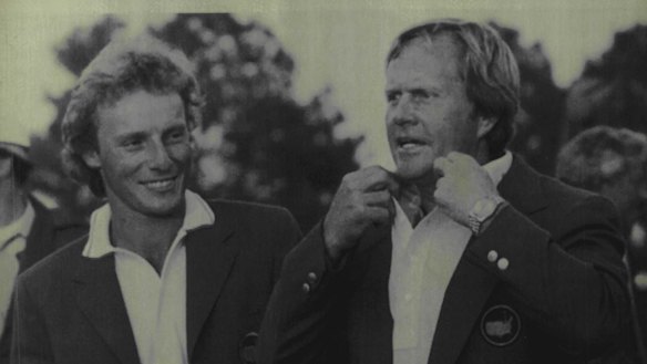 Jack Nicklaus tries on his sixth green jacket as Masters champion as Bernhard Langer looks on in 1986.