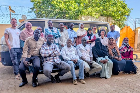 Shelley Cook, back row, third from right, wearing glasses, with her Medecins Sans Frontieres team in their compound in Kosti, Sudan.