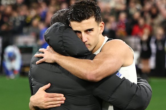 Collingwood coach Craig McRae and stand-in captain Nick Daicos embrace after their side was eliminated from this year’s finals series.