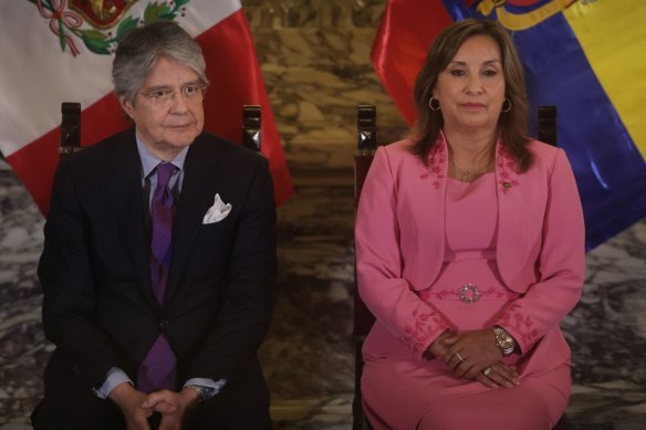 Peruvian President Dina Boluarte, seen with Ecuadorian President Guillermo Lasso, has been criticized for her watch collection.