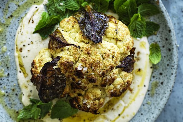 Whole roasted cauliflower with hummus and honey.