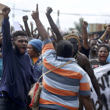 Papuans shout slogans during a protest in Timika, Papua, on August 21.