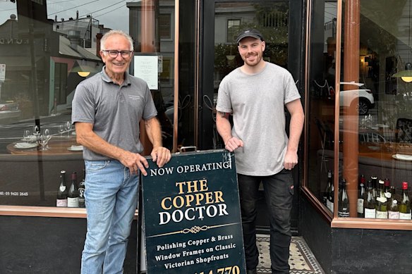 James and Martini in front of Clover restaurant in Richmond, where they restored copper in the facade.