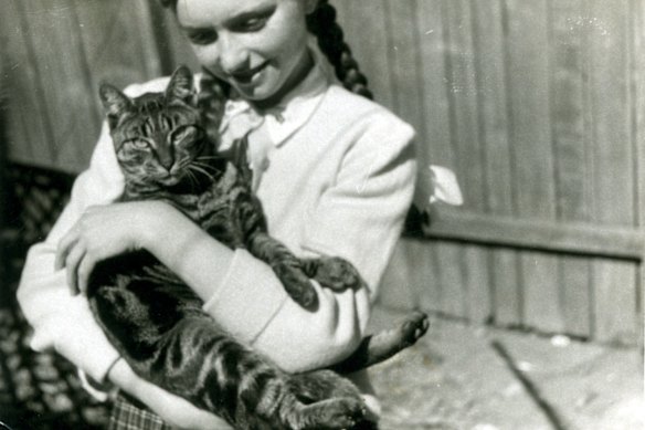 Joy Nason pictured with her beloved cat Tiddles in the 1960s.