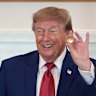 President Donald Trump holds a solid gold replica of a deep sea nodule he was gifted during a roundtable on American mining on Friday.