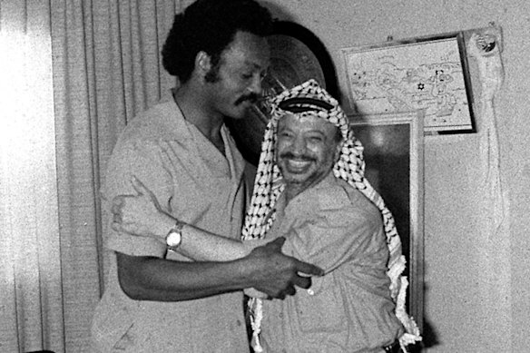 Jackson embraces PLO leader Yasser Arafat in Beirut in 1979.