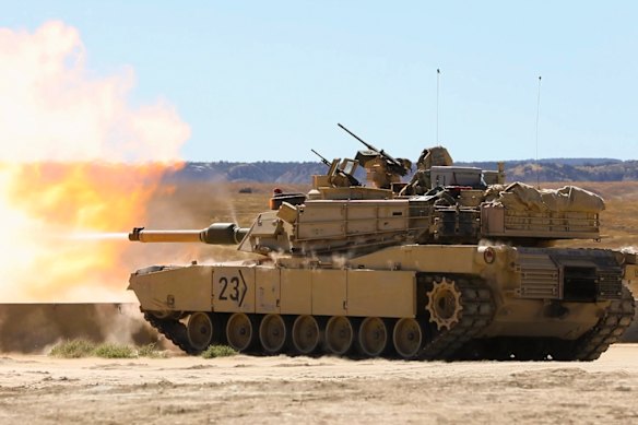 US Army troops fire an Abrams tank.