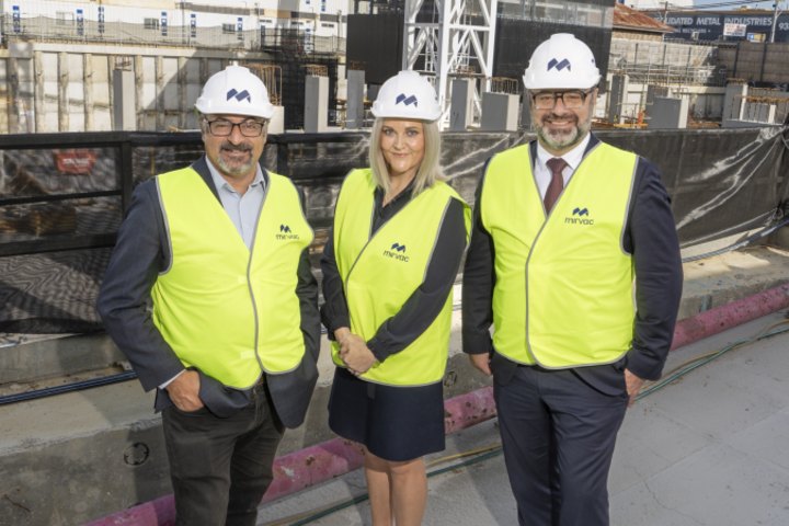 Mirvac development CEO Stuart Penklis, right, with Wills MP Peter Khalil and Mirvac’s residential head for Victoria and WA Elysa Anderson in Brunswick on Tuesday.