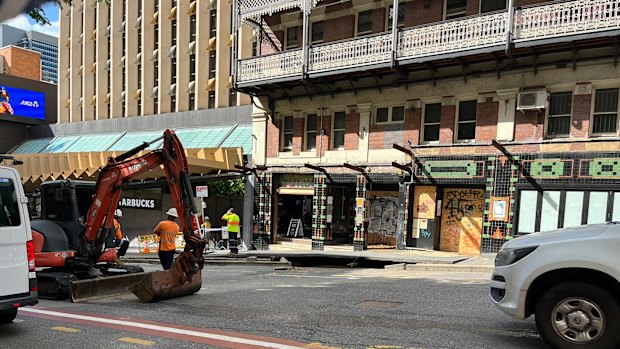 The burst water main on Edward Street, outside the old People’s Palace backpackers building near the corner of Ann Street.