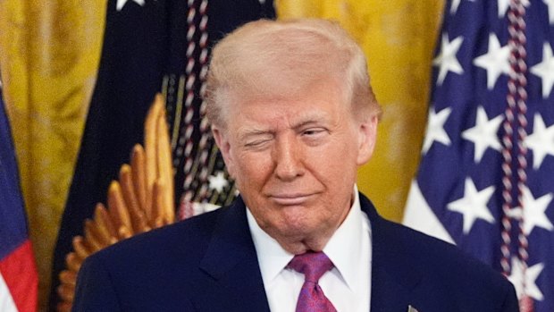 President Donald Trump winks during an event to sign a bill blocking California’s rule banning the sale of new gas-powered cars by 2035 on Thursday.