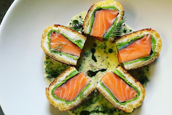 Salmon, wrapped in crab meat, herb gallete and brioche.