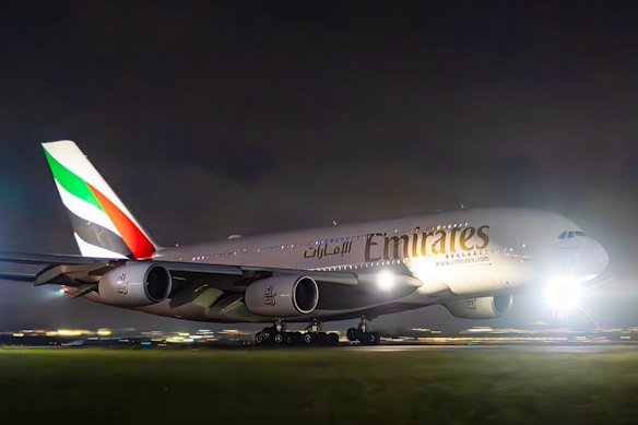 An Emirates flight lands.