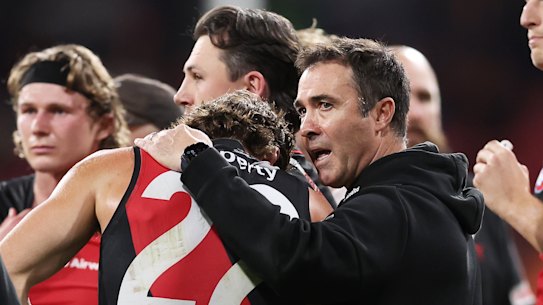 Brad Scott has a word with milestone man Sam Durham during a break in the clash with the Giants.