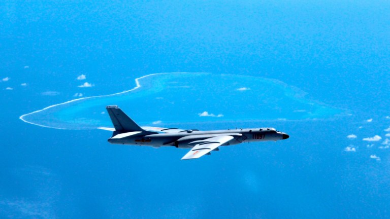 A Chinese H-6K bomber patrols the islands and reefs in the South China Sea.