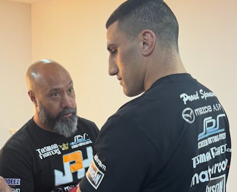 Australian heavyweight boxer Justis Huni (right) with trainer Keri Fiu.