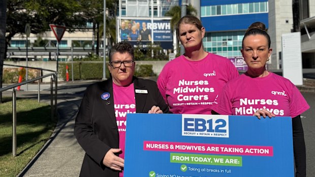 Union representatives speak outside the Royal Brisbane and Women’s Hospital as they take industrial action over ongoing wage negotiations.