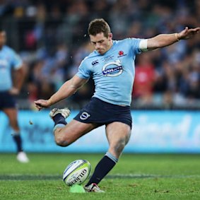  Bernard Foley kicks the winning penalty goal in the Super Rugby final against the Crusaders at ANZ Stadium.