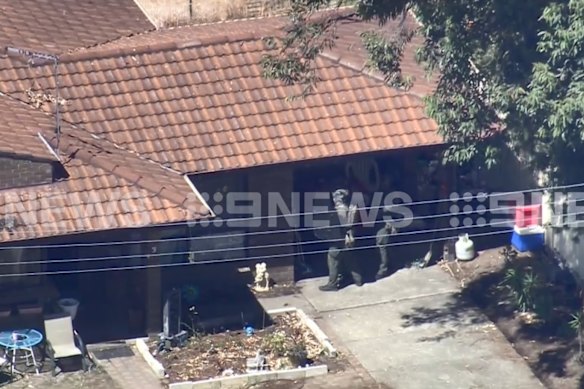 Tactical response officers outside a house in Pinjarra.