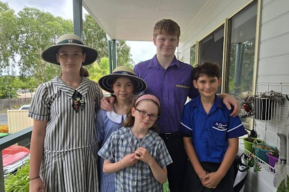 Brisbane parent Dom Woodall sends (from left) Lilly, Jagger, Thea, Zaeyan, and Tais to different Catholic schools.