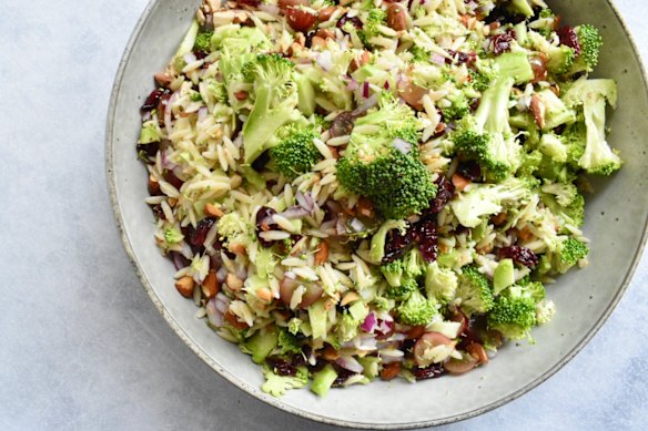 Before serving, add the creamy dressing to this broccoli, dried cranberry, risoni and grape salad.