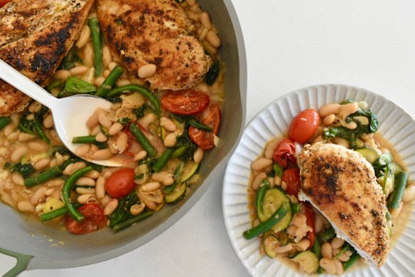 White beans and seasonal vegies add substance to this one-pan chicken dish.