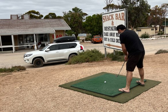 Fore! Vaz Pilikian tees off on the Nullarbor Links golf course in Madura, WA.
