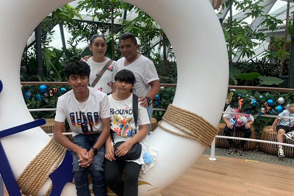 Rahmah Abdul Hameed with her husband, son Reda who is about to start year 11 and her daughter, Rafiqa, who is going into year 7.