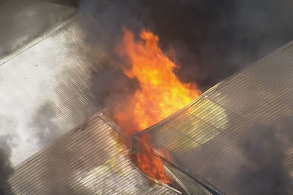 A blaze engulfed the roof of a service station in Sydney’s south-west on Tuesday afternoon. 