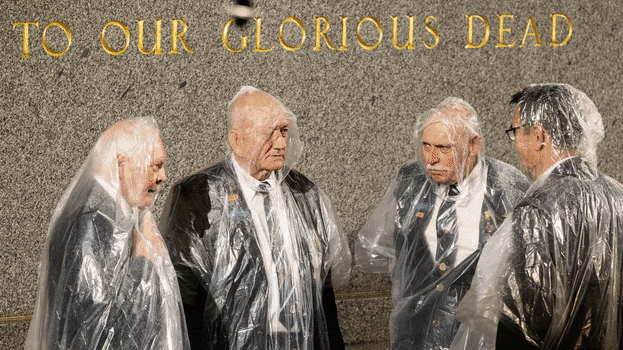 Crowds gather despite the rain at the Anzac Day dawn service at Dee Why Beach last year.