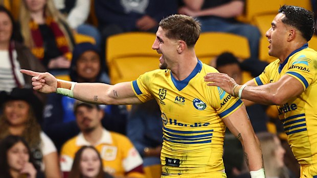 Zac Lomax celebrates a try for Parramatta.