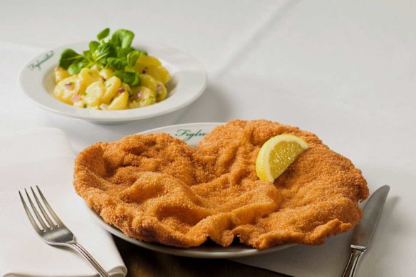 A classic Austrian-style Wiener schnitzel at Figlmuller correctly occupying all, or more, of its plate.