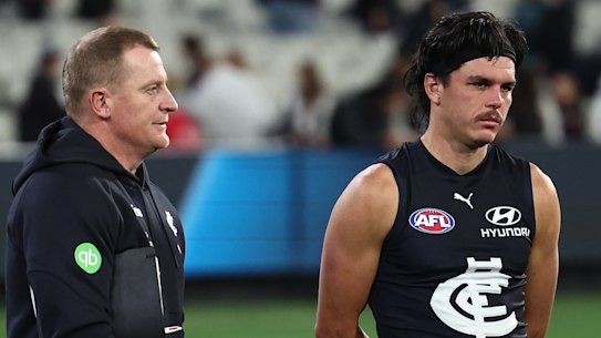 Hollands (right) with Blues coach Michael Voss after the loss to Collingwood.