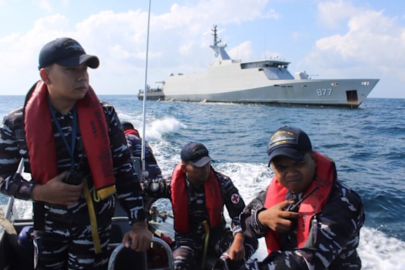 Indonesian Navy personnel cruises on a rubber boat during a search for victims after a passenger boat that sank in the waters near Balaloho Island in South Sulawesi on July 15.