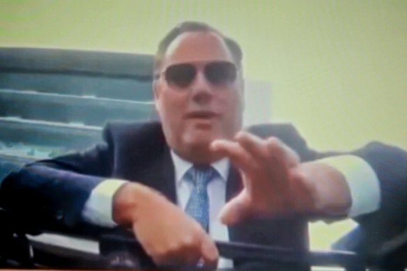 Thoroughbred owner Nick Williams speaks to former Macedon Lodge employee Mark Dosen in front of The Grandstand at Flemington Racecourse in 2023.