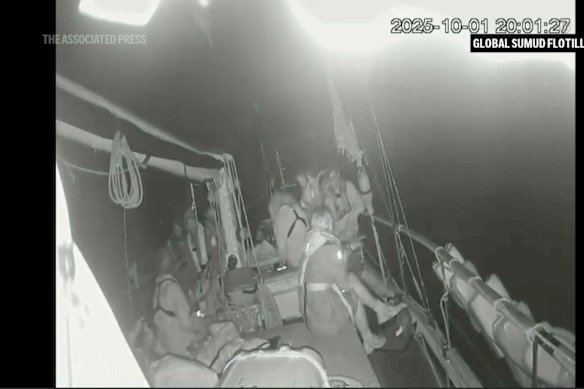 A live video feed from one of the boats in the flotilla showed passengers in life vests sitting on deck.