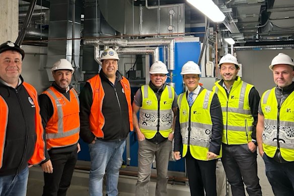 Sergio Gonzalez and Fair Trading Minister Anoulack Chanthivong (second and third from right) at Westmead Health Precinct in May.
