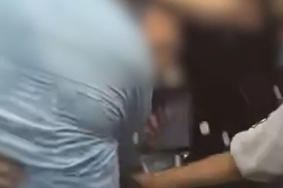 A still from the video where a Scots College student was humiliated after being forced to walk through a human tunnel.